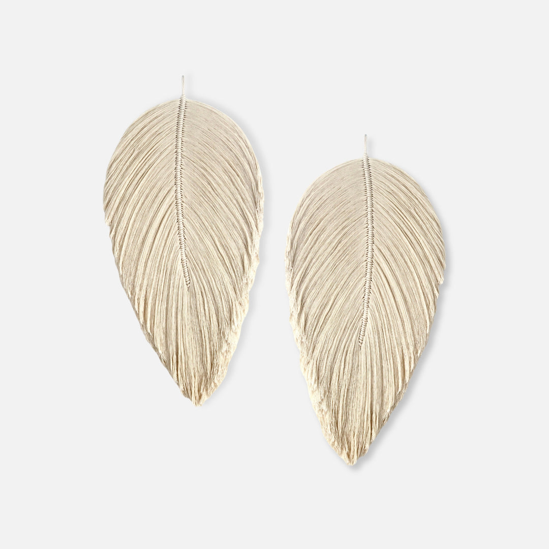 Handmade rope sculpture of leaves for home decor by Yashi Designs made from natural color organic cotton rope, showcasing intricate knotwork and modern design. Perfect for housewarming gifts and luxury home decor.
