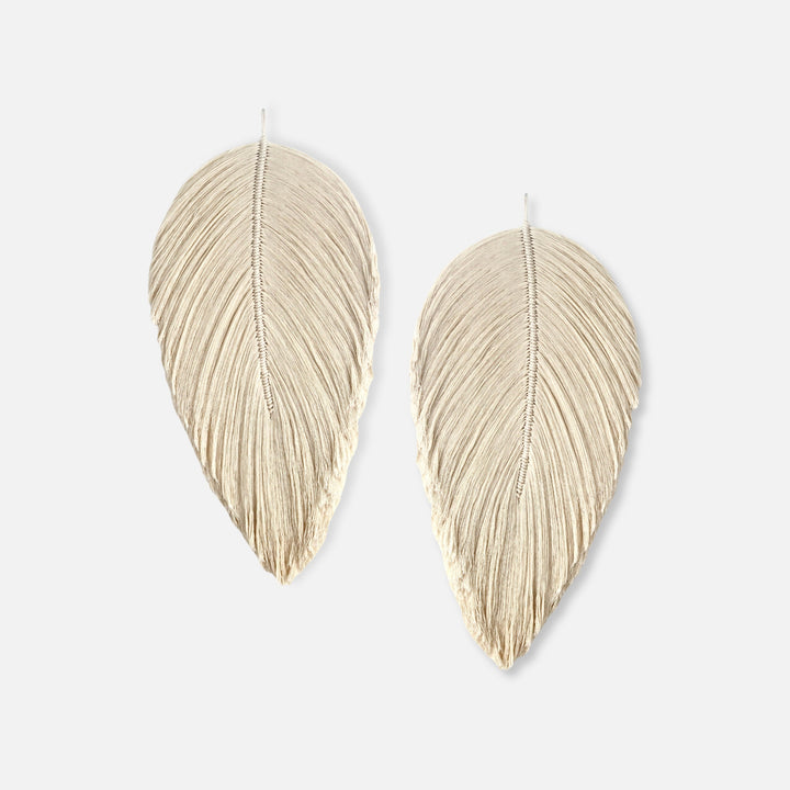 Handmade rope sculpture of leaves for home decor by Yashi Designs made from natural color organic cotton rope, showcasing intricate knotwork and modern design. Perfect for housewarming gifts and luxury home decor.