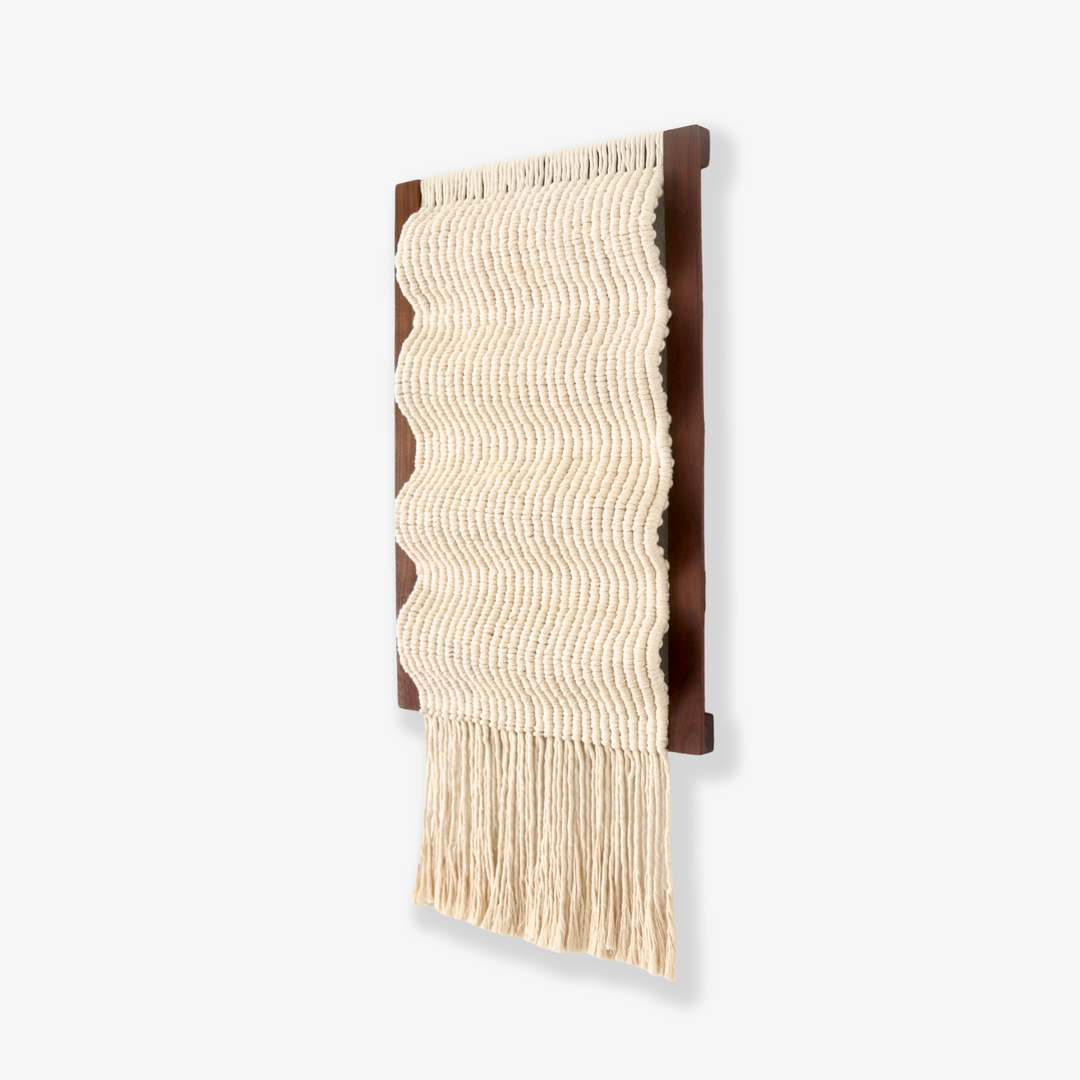 Minimalistic knotted wall hanging sculpture 'Waves' by Yashi Designs, a contemporary art piece.