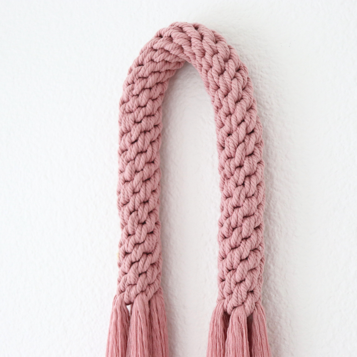 Knotted Macrame Wall Hanging, Handwoven wall hanging in dusty pink, showcasing an elegant knotted macrame style - Yashi Designs