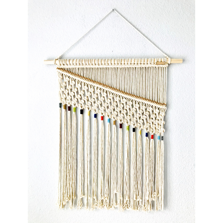 Artistic macrame wall hanging with colorful accents, adding a elegant handmade charm to your decor - Yashi Designs