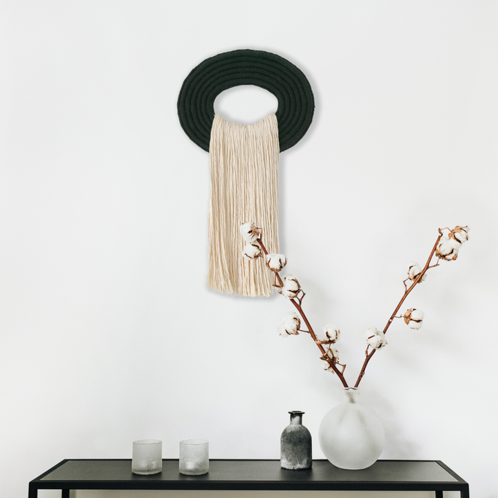 Elegant beige wall hanging tassel with a distinctive black circular accent for a modern decorative touch with Contemporary Wall hangings