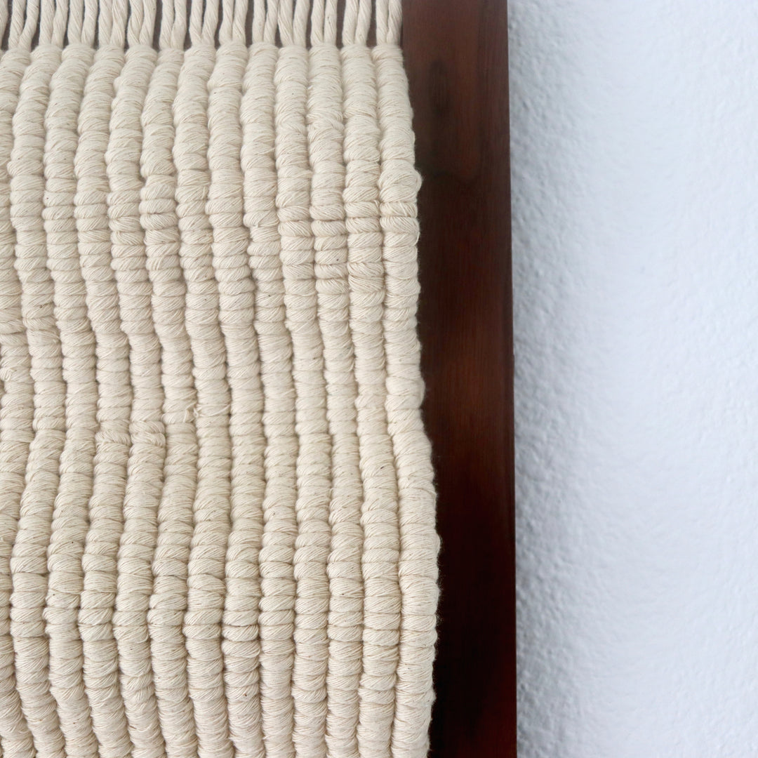 Minimalistic knotted wall hanging sculpture 'Waves' by Yashi Designs, a contemporary art piece.