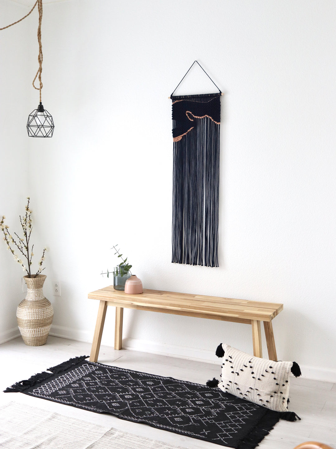 Navy blue macrame wall hanging with an unique design of artwork, creating a stunning visual contrast and contemporary elegance in any wall decor and luxury interior.