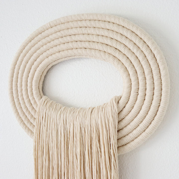 Elegant beige wall hanging tassel with a distinctive beige circular accent for a modern decorative touch with Contemporary Wall hangings