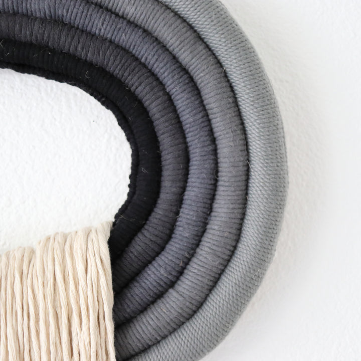 Elegant white wall hanging tassel with a distinctive grey & black circular accent for a modern decorative touch with Contemporary Wall hangings