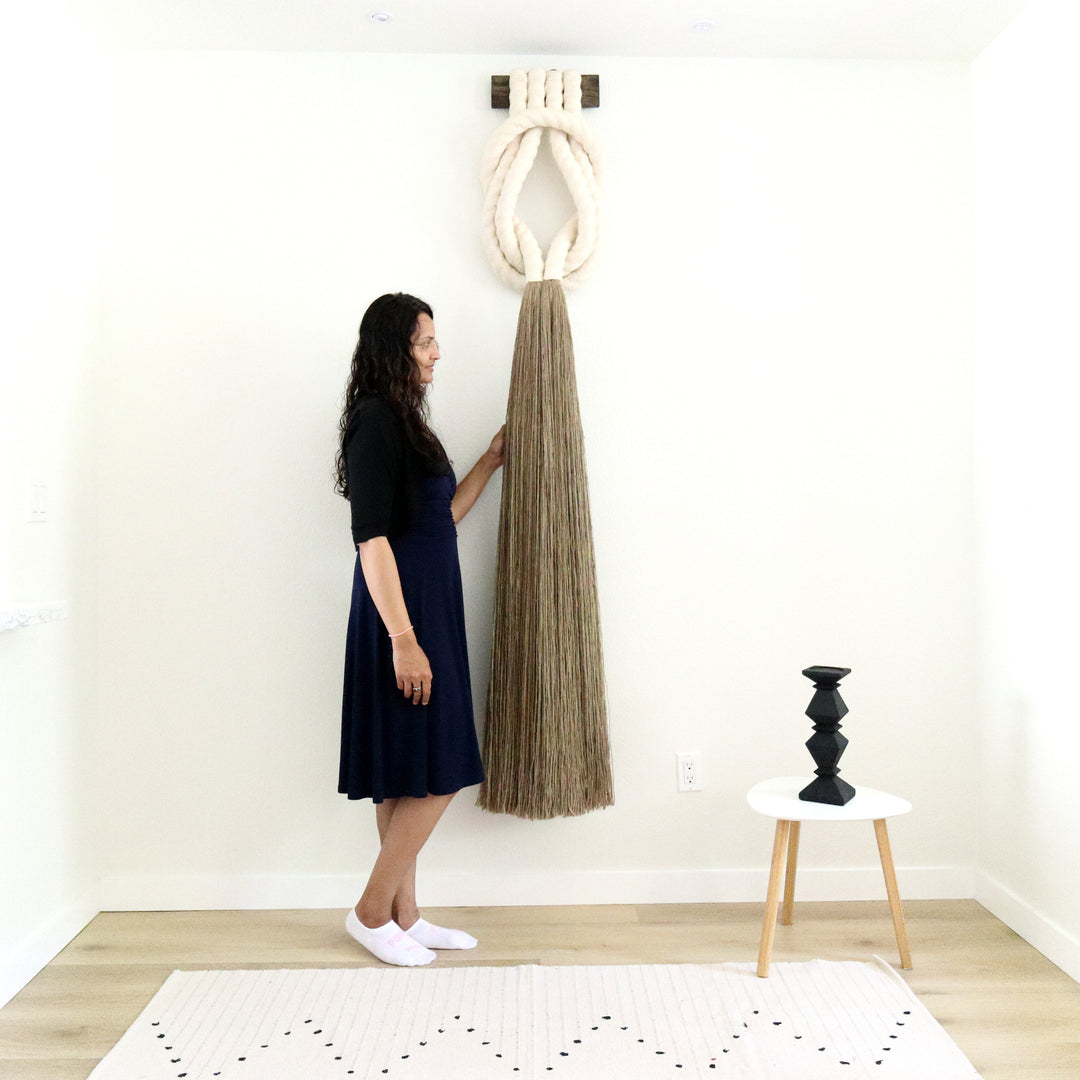 Minimalist beige rope design wall hanging with a long tassel, created by Yashi Designs as a serene addition to any space and interior, Customized Art Installations, Sustainable Fiber Art