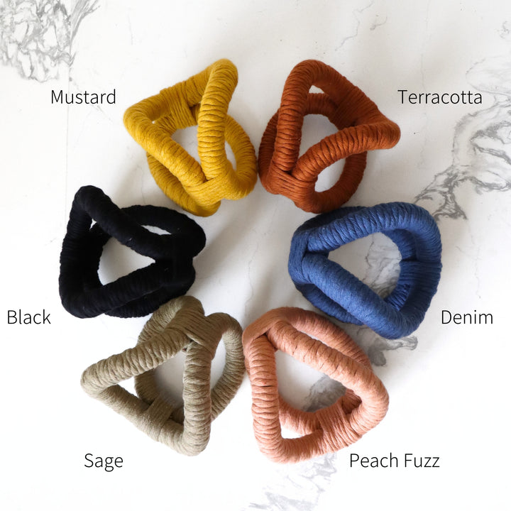 Color options chart with terracotta, sage, mustard, black, Denim, Ivory and Peach fuzz color.