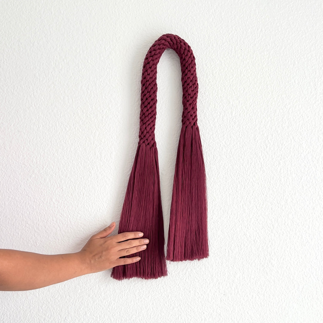 Rich wine-colored fiber art wall hanging, presenting a contemporary knotted aesthetic - Yashi Designs