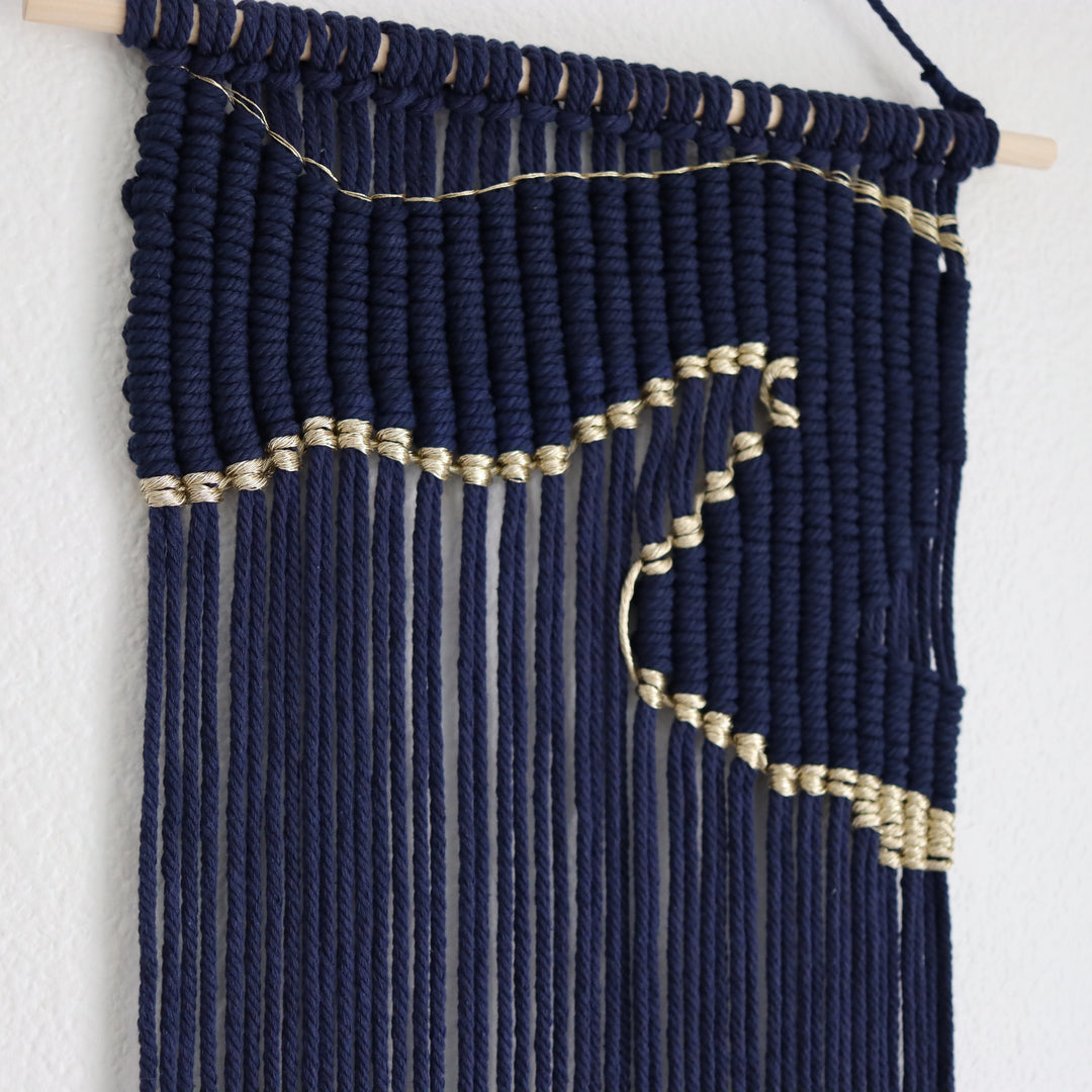 Contemporary navy blue macrame wall hanging with unique and modern beige design, creating a modern and artistic statement in any space or interior
