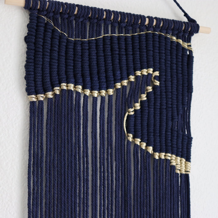 Contemporary navy blue macrame wall hanging with unique and modern beige design, creating a modern and artistic statement in any space or interior