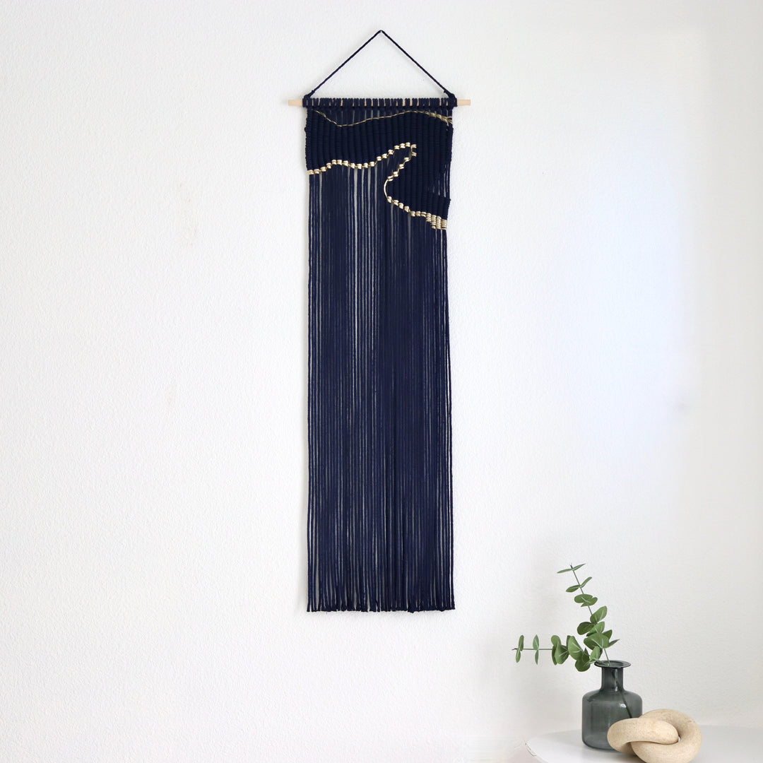 Contemporary navy blue macrame wall hanging with unique and modern beige design, creating a modern and artistic statement in any space or interior