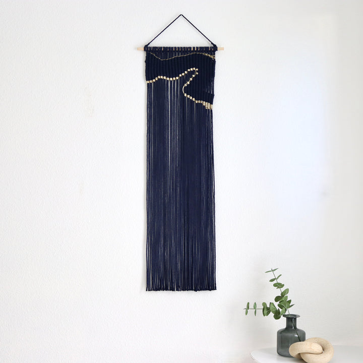 Contemporary navy blue macrame wall hanging with unique and modern beige design, creating a modern and artistic statement in any space or interior