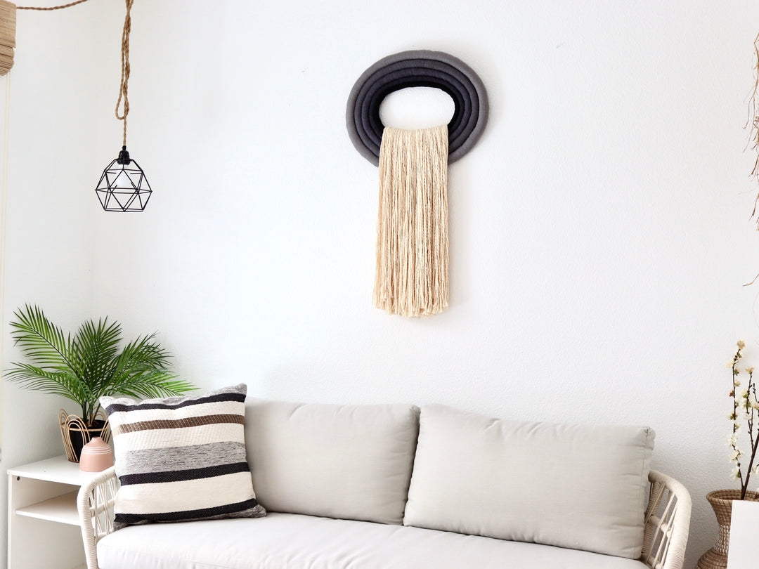 Elegant white wall hanging tassel with a distinctive grey & black circular accent for a modern decorative touch with Contemporary Wall hangings