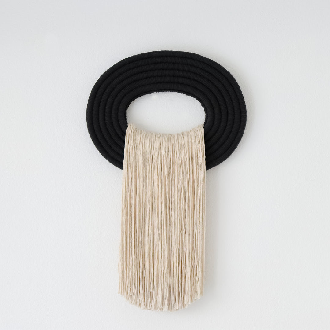 Nature inspired modern Fiber art wall hanging and rope sculptures with earthy tones and organic textures.