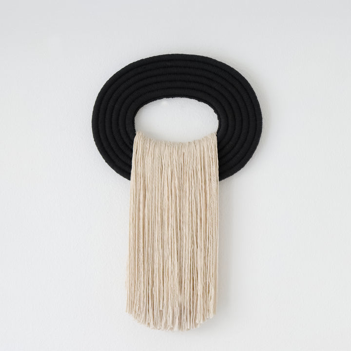 Nature inspired modern Fiber art wall hanging and rope sculptures with earthy tones and organic textures.