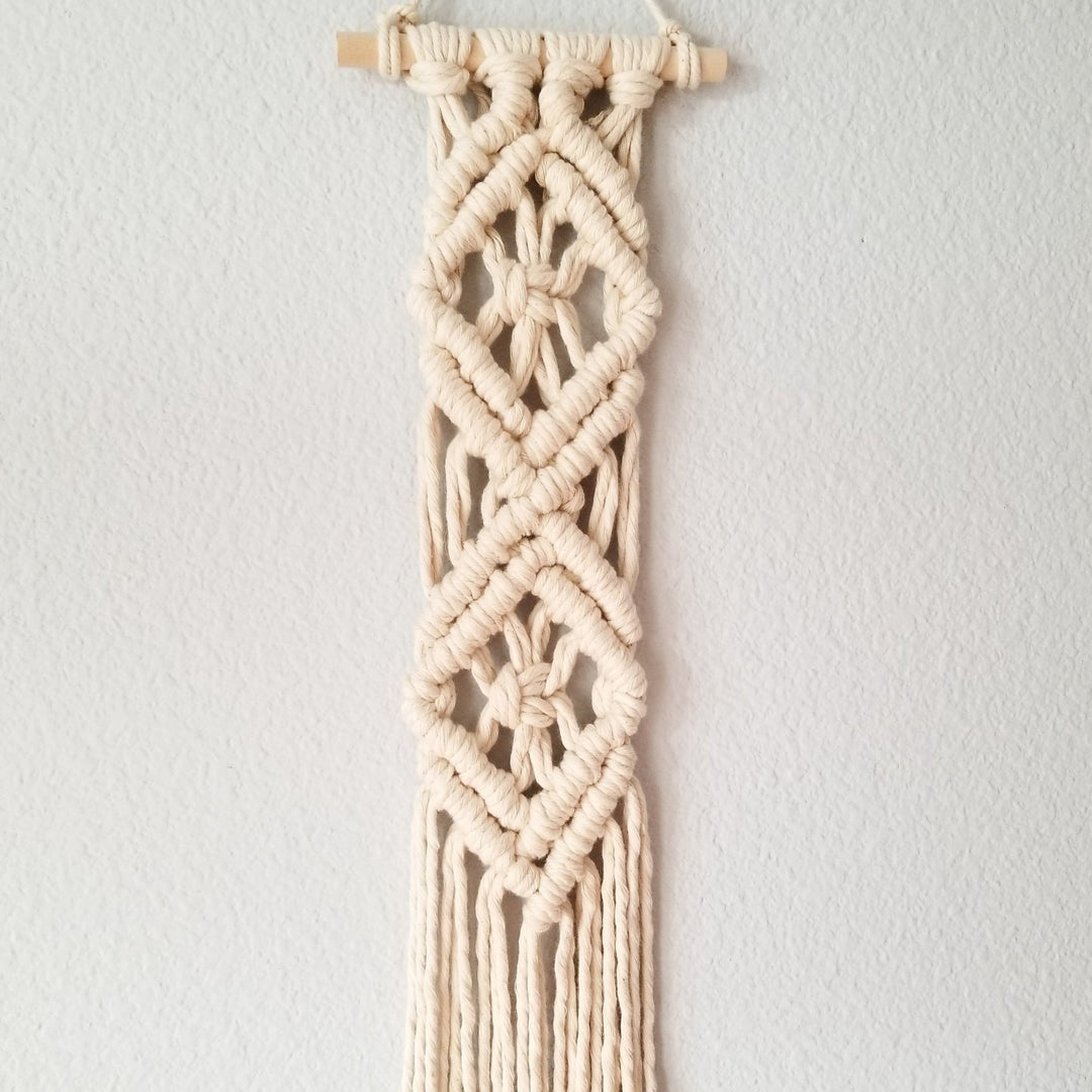 Close up on Diamond Tassel Tassel Wall Hanging-Diamond Tassel Intricate macrame wall hanging with unique pattern, handcrafted to add a rustic art touch to any decor