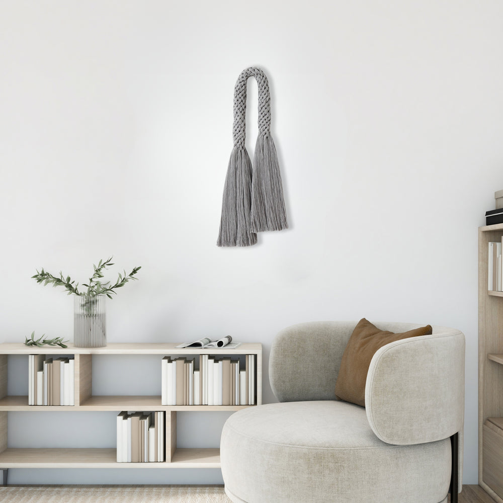 Modern macrame rope wall hanging in grey, epitomizing contemporary fiber art - Yashi Designs Fiber art wall hanging.