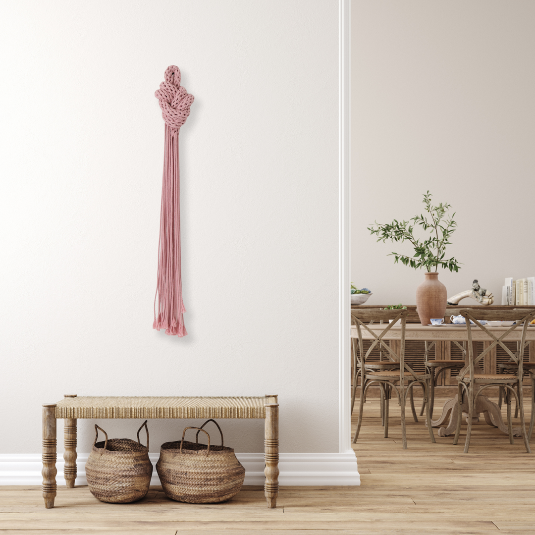 In situ display of knotted wall hanging in an entryway, adding texture and style to the welcoming space