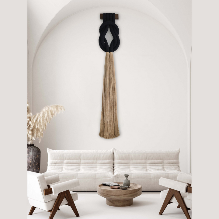 Minimalist beige rope design wall hanging with a long tassel, created by Yashi Designs as a serene addition to any space and interior 