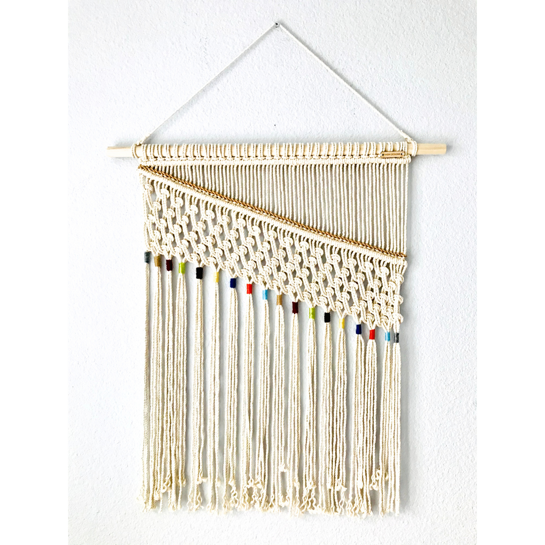 Artistic macrame wall hanging with colorful accents, adding a elegant handmade charm to your decor - Yashi Designs