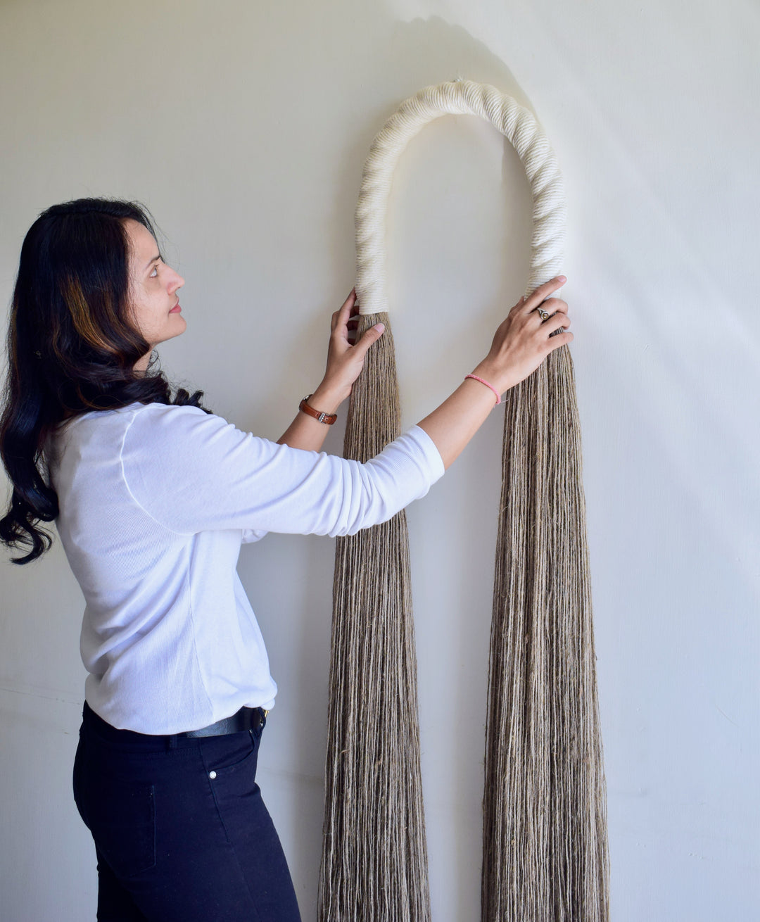 Tall rustic rope sculpture arch exuding natural charm and bohemian elegance - Yashi Designs