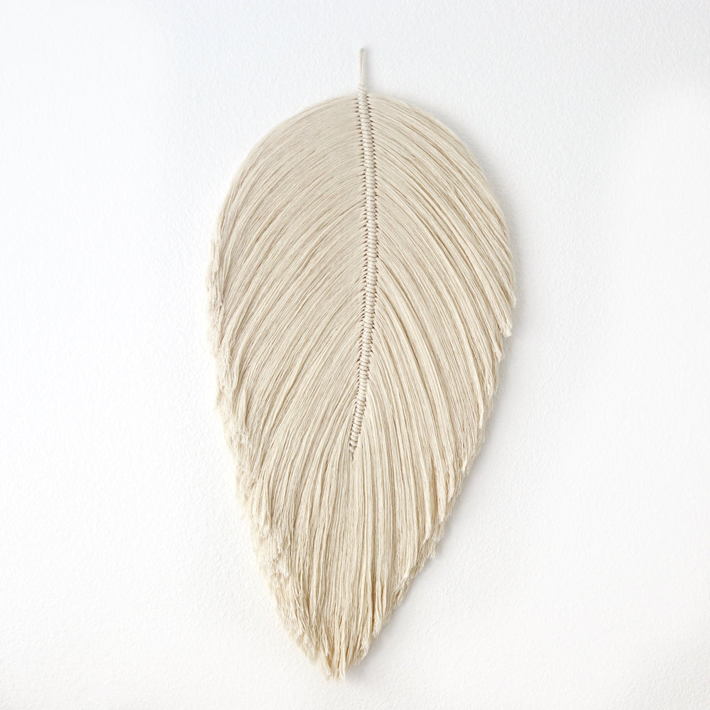 Handmade rope sculpture of leaves for home decor by Yashi Designs made from natural color organic cotton rope, showcasing intricate knotwork and modern design. Perfect for housewarming gifts and luxury home decor.