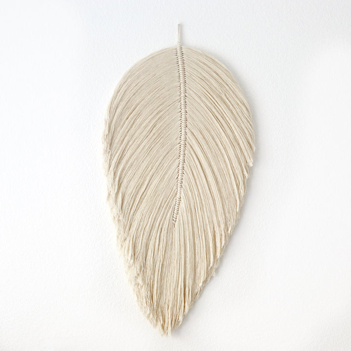 Handmade rope sculpture of leaves for home decor by Yashi Designs made from natural color organic cotton rope, showcasing intricate knotwork and modern design. Perfect for housewarming gifts and luxury home decor.