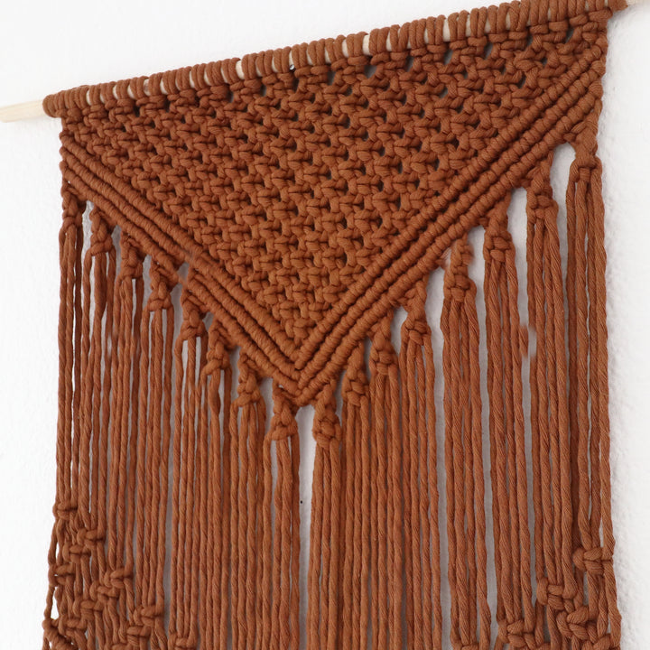 earthy Macrame wall hanging close-up – fiber art craftsmanship