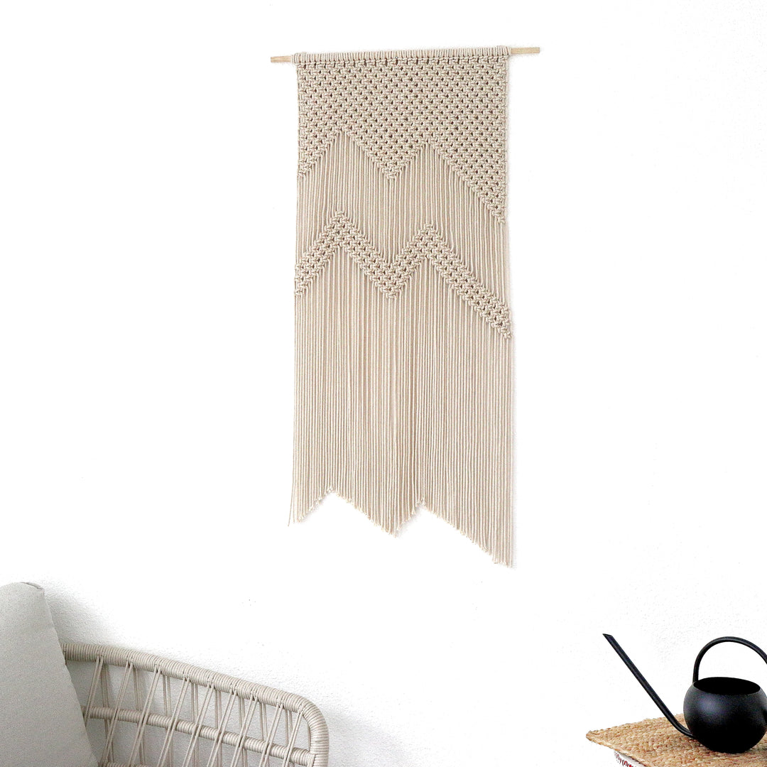 Neutral macrame mountain wall hanging for cozy interiors