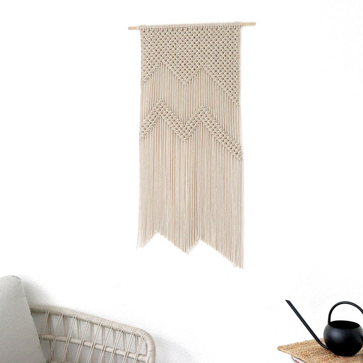 Neutral macrame mountain wall hanging for cozy interiors