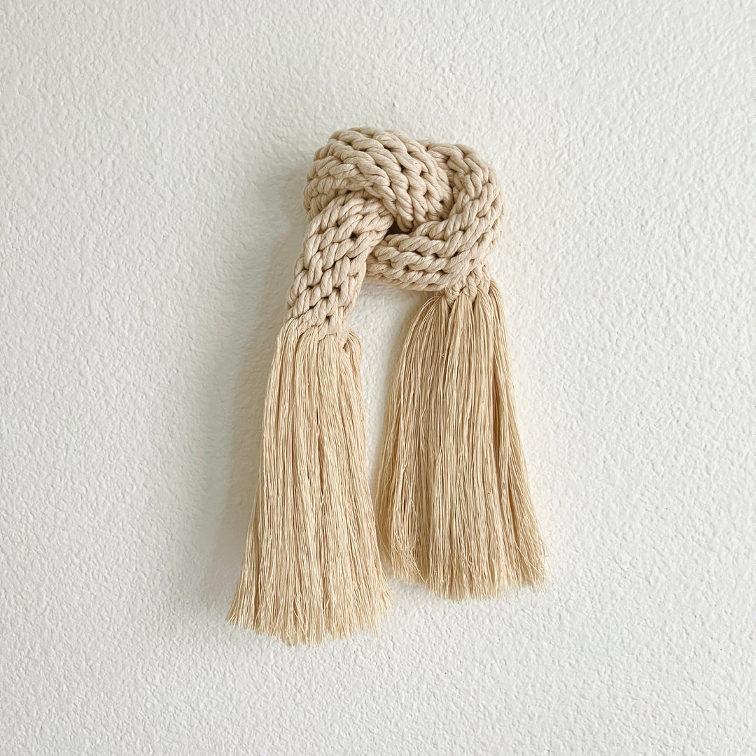 Simple knotted cotton rope artwork symbolizing connection.