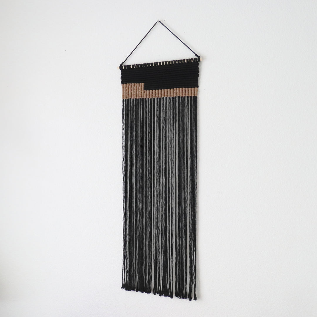 Serenity contemporary wall hanging in grey, a unique fiber art offering a soothing aesthetic by Yashi Designs. Contemporary macrame wall hanging in Black.