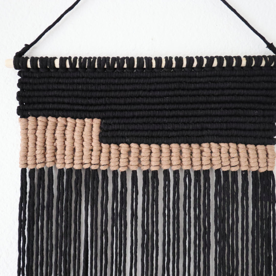 Serenity contemporary wall hanging in grey, a unique fiber art offering a soothing aesthetic by Yashi Designs. Contemporary macrame wall hanging in Black.
