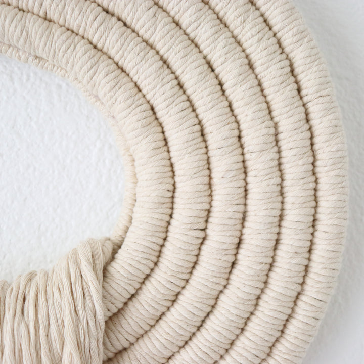Elegant beige wall hanging tassel with a distinctive beige circular accent for a modern decorative touch with Contemporary Wall hangings