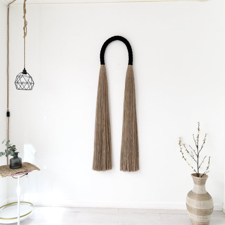 Tall rustic rope sculpture arch exuding natural charm and bohemian elegance - Yashi Designs