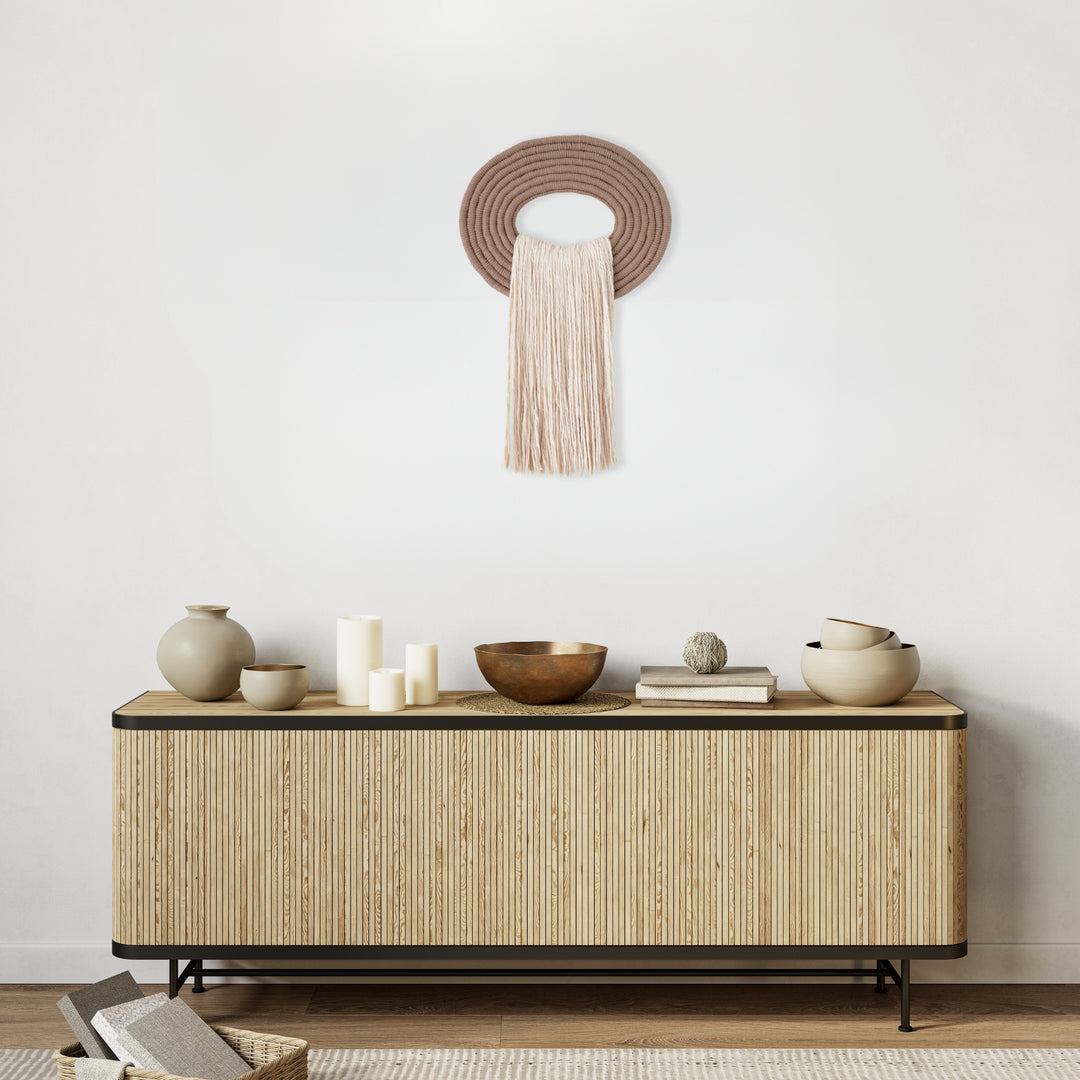 Elegant white wall hanging tassel with a distinctive beige circular accent for a modern decorative touch with Contemporary Wall hangings