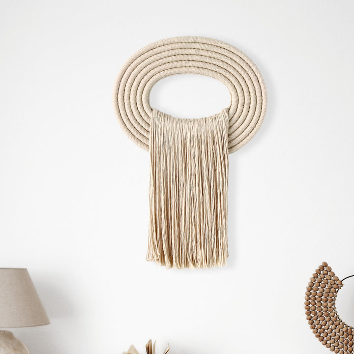 Elegant beige wall hanging tassel with a distinctive beige circular accent for a modern decorative touch with Contemporary Wall hangings