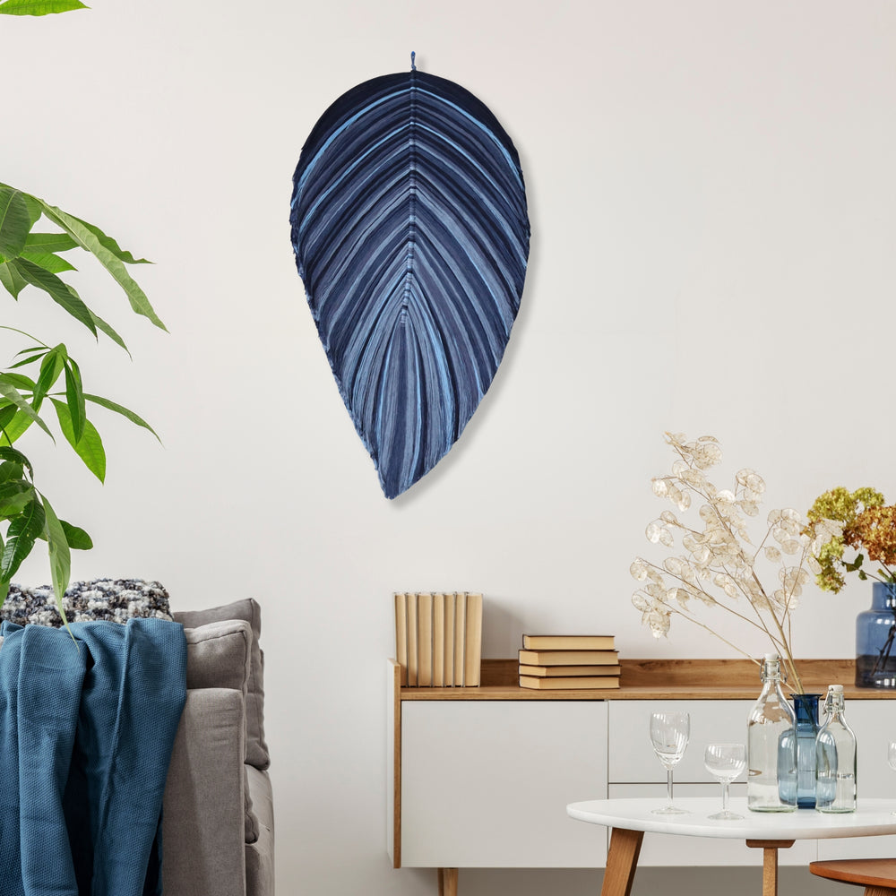 Handmade rope sculpture of leaf by Yashi Designs made organic cotton rope in shades of blue colors showcasing intricate knotwork and modern design. Perfect for housewarming gifts and luxury home decor.