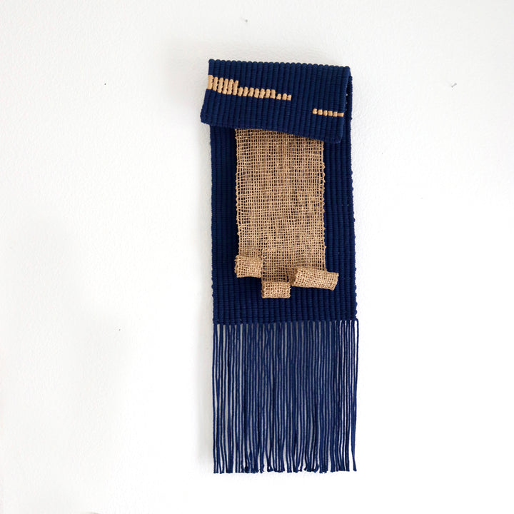 Navy blue and beige textured wall hanging with jute accents, handcrafted by Yashi Designs, perfect for adding depth and artisanal charm to any interior