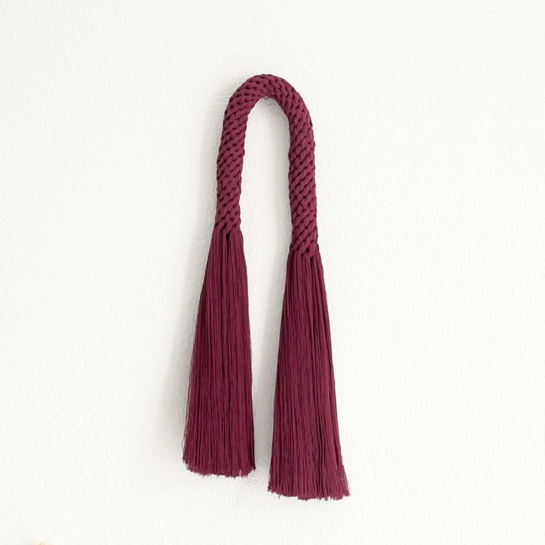 Rich wine-colored fiber art wall hanging, presenting a contemporary knotted aesthetic - Yashi Designs
