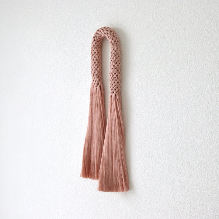 Warm peach fiber art wall hanging, handwoven into a modern rope knotted macrame pattern - Yashi Designs