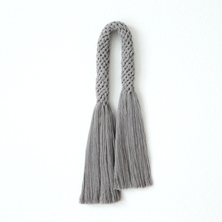 Modern macrame rope wall hanging in grey, epitomizing contemporary fiber art - Yashi Designs Fiber art wall hanging.
